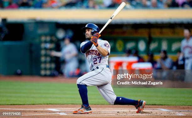 Jose Altuve of the Houston Astros bats during the game against the Oakland Athletics at the Oakland Alameda Coliseum on June 13, 2018 in Oakland,...