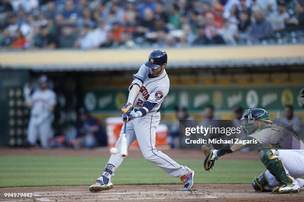 Josh Reddick of the Houston Astros bats during the game against the Oakland Athletics at the Oakland Alameda Coliseum on June 13, 2018 in Oakland,...