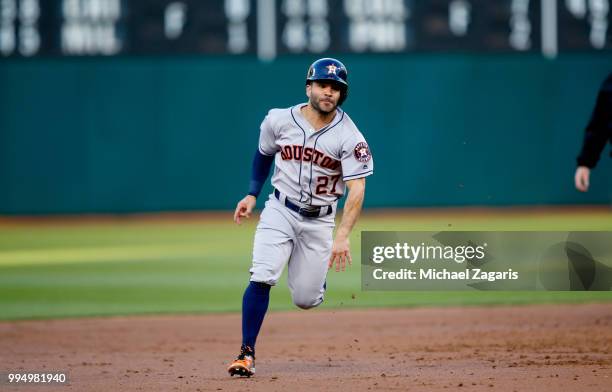 Jose Altuve of the Houston Astros runs the bases during the game against the Oakland Athletics at the Oakland Alameda Coliseum on June 13, 2018 in...