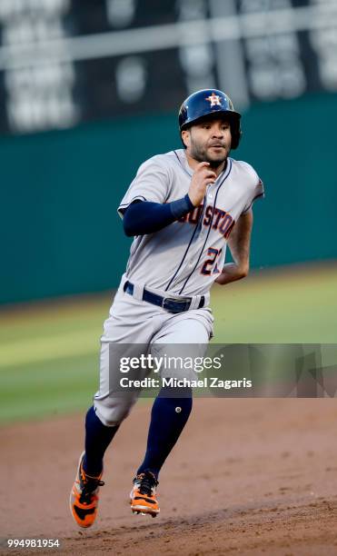 Jose Altuve of the Houston Astros runs the bases during the game against the Oakland Athletics at the Oakland Alameda Coliseum on June 13, 2018 in...