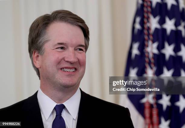 Circuit Judge Brett M. Kavanaugh looks on as U.S. President Donald Trump introduces him as his nominee to the United States Supreme Court during an...