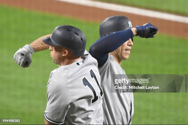 Brett Gardner of the New York Yankees celebrates a two-run home run with Aaron Judge in the third during game two of a doubleheader baseball game...