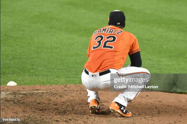 Yefry Ramirez of the Baltimore Orioles reacts after giving up a two-run home run to Brett Gardiner of the New York Yankees in the third inning during...