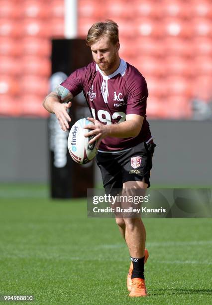 Cameron Munster kicks the ball during the Queensland Maroons State of Origin Captain's Run at Suncorp Stadium on July 10, 2018 in Brisbane, Australia.