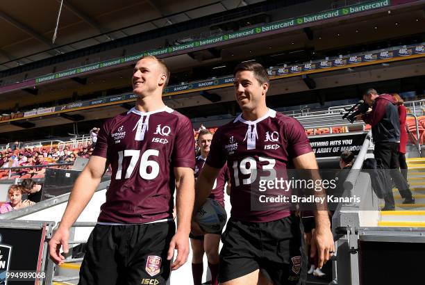 Daly Cherry-Evans and Ben Hunt enter the field together during the Queensland Maroons State of Origin Captain's Run at Suncorp Stadium on July 10,...