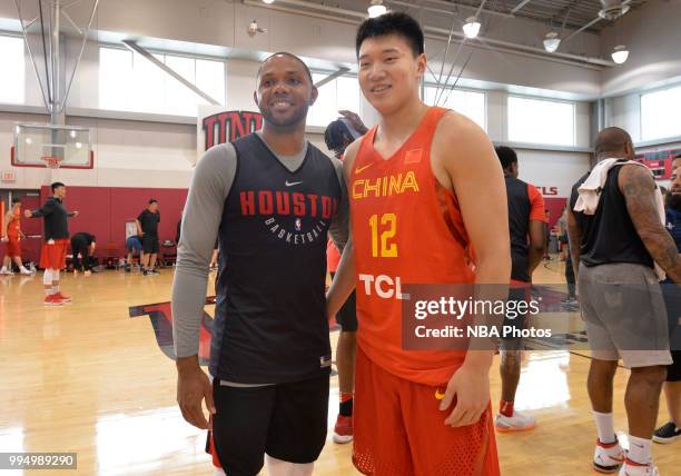 Eric Gordon of the Houston Rockets and a member of the China National Team pose for a photo after a workout on July 7, 2018 at Mendehall Arena at...