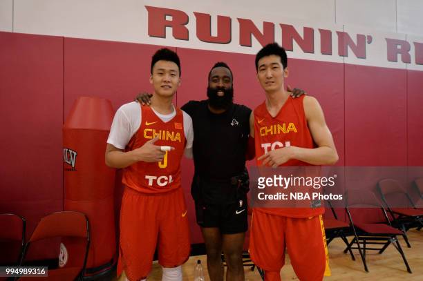 James Harden of the Houston Rockets and two members of the China National Team pose for a photo after a workout on July 7, 2018 at Mendehall Arena at...