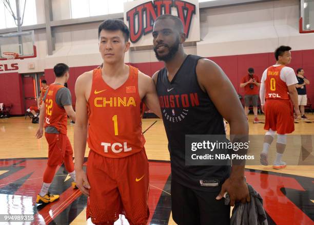 Chris Paul of the Houston Rockets and a member of the China National Team pose for a photo after a workout on July 7, 2018 at Mendehall Arena at UNLV...