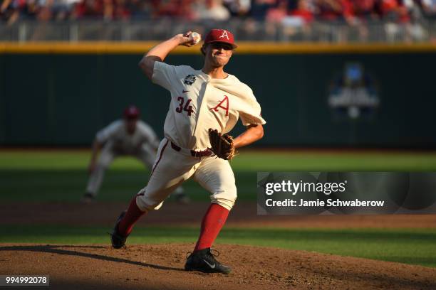 Jake Reindl of the Arkansas Razorbacks pitches against the Oregon State Beavers during the Division I Men's Baseball Championship held at TD...