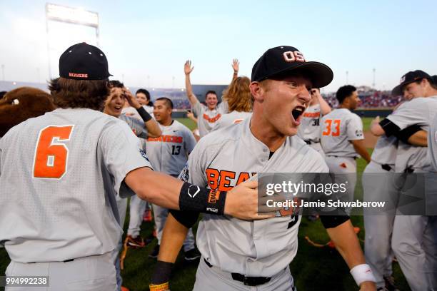 Andy Armstrong of the Oregon State Beavers celebrates after defeating the Arkansas Razorbacks during the Division I Men's Baseball Championship held...