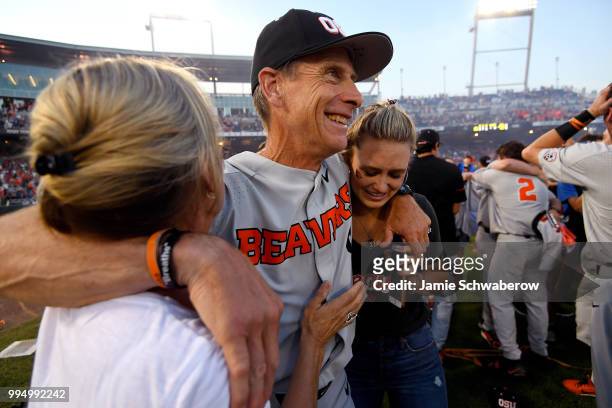 Head Coach Pat Casey of the Oregon State Beavers celebrates with his family after defeating the Arkansas Razorbacks during the Division I Men's...