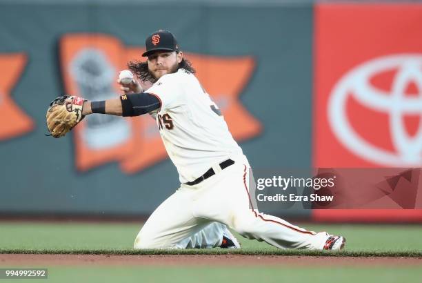 Brandon Crawford of the San Francisco Giants fields a ball against the Arizona Diamondbacks at AT&T Park on June 4, 2018 in San Francisco, California.