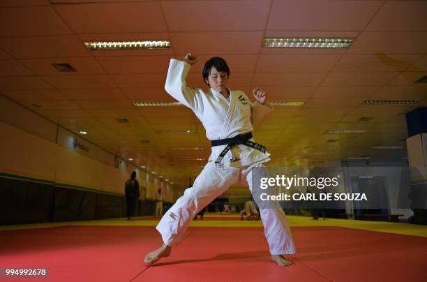 Japanese 35-year-old black belt Yuko Fujii, head coach of the Brazilian men's national team, warms up before giving a class in Rio de Janeiro,...