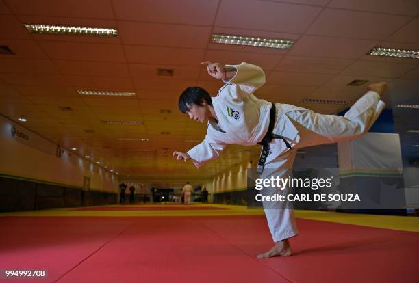 Japanese 35-year-old black belt Yuko Fujii, head coach of the Brazilian men's national team, warms up before giving a class in Rio de Janeiro,...