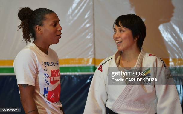 Brazilian 2016 Summer Olympics gold medalist Rafaela Silva talks to Japanese 35-year-old black belt Yuko Fujii, head coach of the Brazilian men's...