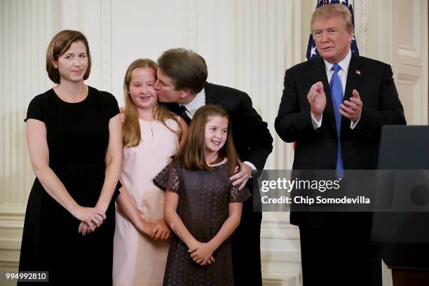 Judge Brett M. Kavanaugh kisses his daughter Margaret as he is joined by his wife Ashley Estes Kavanaugh and daughter Liza, after U.S. President...