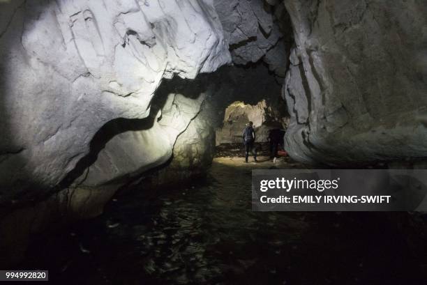 Employees of the Cypriot department of fisheries and marine research check a cave as they collect data on the activity of the endangered...