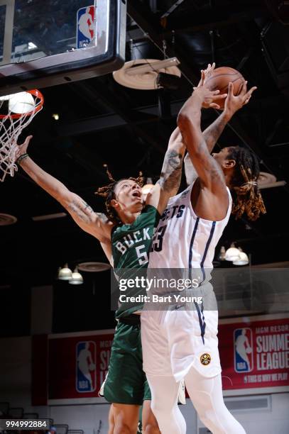 Emanuel Terry of the Denver Nuggets drives to the basket during the game against D.J. Wilson of the Milwaukee Bucks during the 2018 Las Vegas Summer...