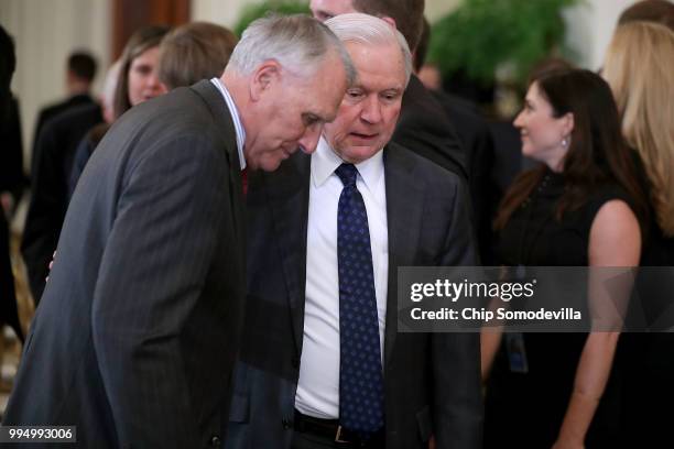 Former U.S. Sen. Jon Kyl talks with U.S. Attorney General Jeff Sessions after President Donald Trump announced Judge Brett M. Kavanaugh as his...