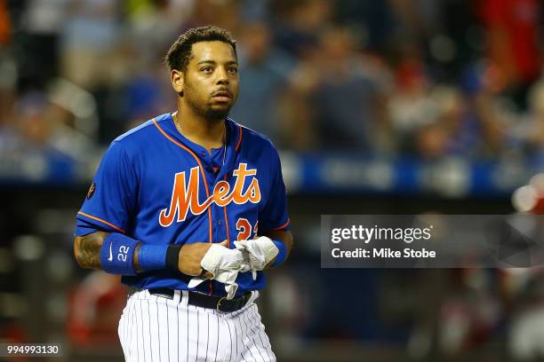 Dominic Smith of the New York Mets reacts after striking out to end the seventh inning against the Philadelphia Phillies during game two of a...