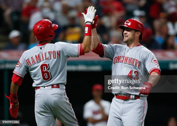 Scott Schebler of the Cincinnati Reds celebrates with Billy Hamilton after hitting a two run home run off Josh Tomlin of the Cleveland Indians during...