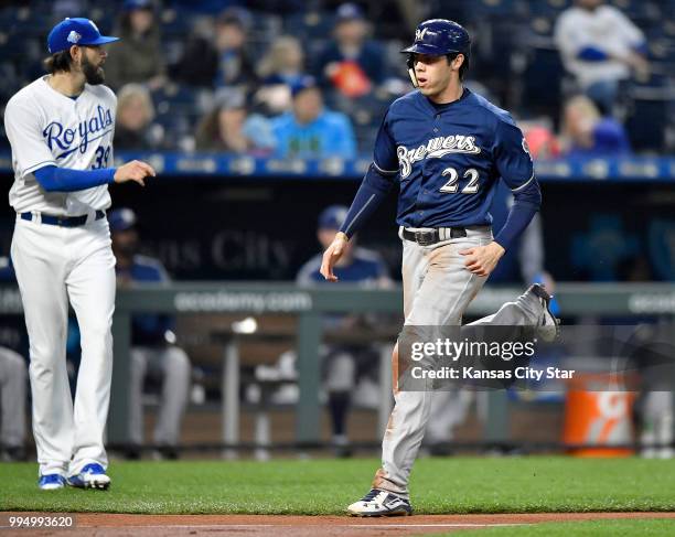 The Milwaukee Brewers' Christian Yelich scores in front of Kansas City Royals starting pitcher Jason Hammel on a double by Travis Shaw in the fourth...