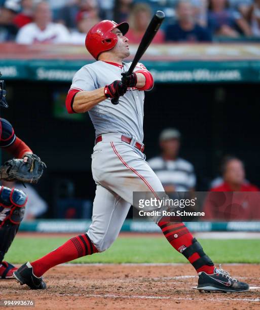 Joey Votto of the Cincinnati Reds hits a solo home run off starting pitcher Mike Clevinger of the Cleveland Indians during the fifth inning at...