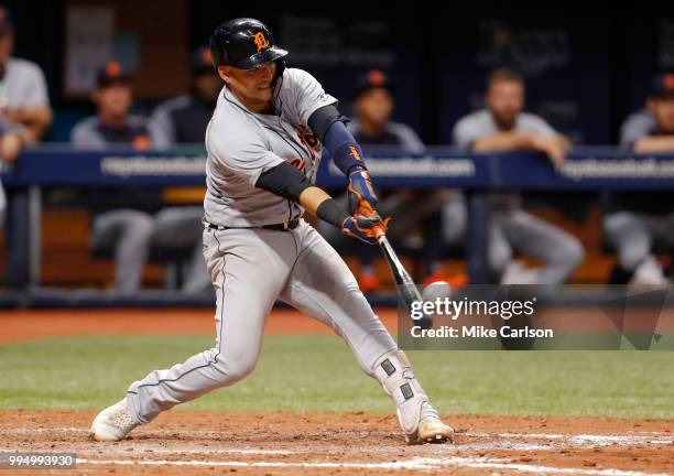 Jose Iglesias of the Detroit Tigers hits a two-RBI double in the seventh inning of a baseball game against the Tampa Bay Rays at Tropicana Field on...