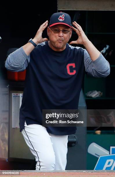 Manager Terry Francona of the Cleveland Indians requests a review of a play against the Cincinnati Reds during the third inning at Progressive Field...