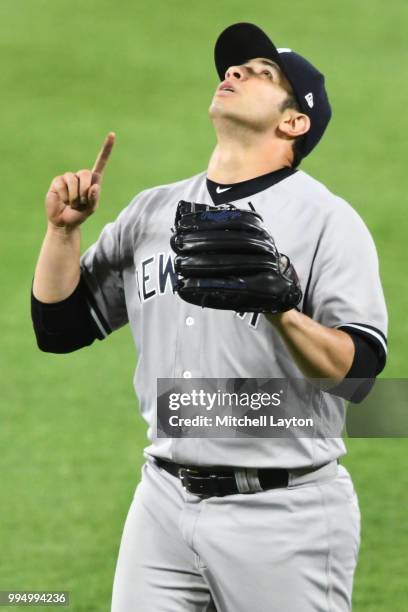 Luis Cessa of the New York Yankees celebrates walking back to the dugout in the sixth inning during game two of a doubleheader baseball game against...