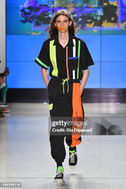 Model walks the runway at the Landlord fashion show during July 2018 New York City Men's Fashion Week at Cadillac House on July 9, 2018 in New York...