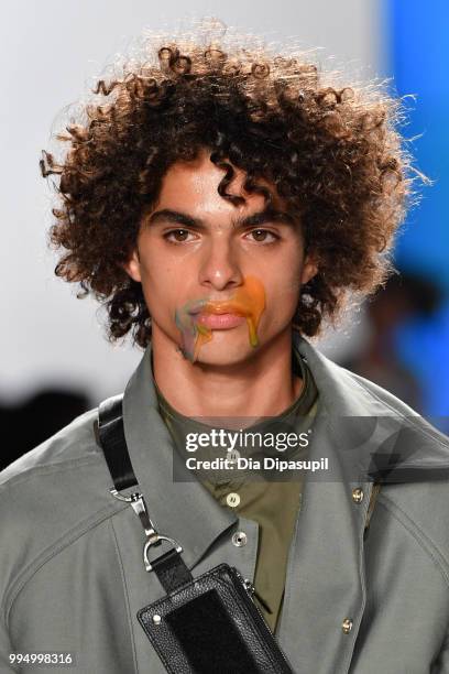 Model walks the runway at the Landlord fashion show during July 2018 New York City Men's Fashion Week at Cadillac House on July 9, 2018 in New York...