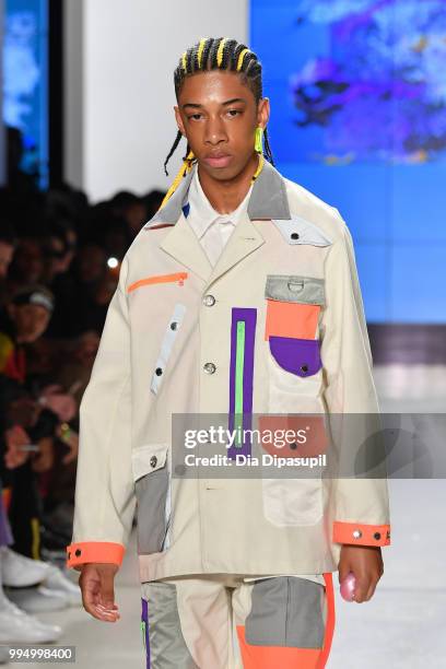 Model walks the runway at the Landlord fashion show during July 2018 New York City Men's Fashion Week at Cadillac House on July 9, 2018 in New York...