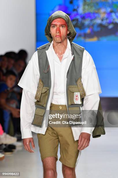 Model walks the runway at the Landlord fashion show during July 2018 New York City Men's Fashion Week at Cadillac House on July 9, 2018 in New York...