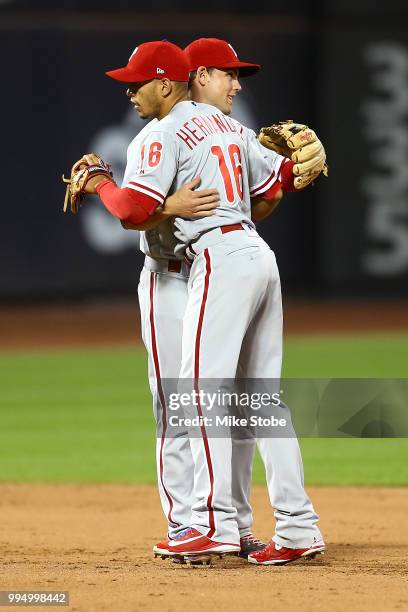 Cesar Hernandez and Scott Kingery of the Philadelphia Phillies celebrate after defeating the New York Mets 3-1 during game two of a doubleheader at...