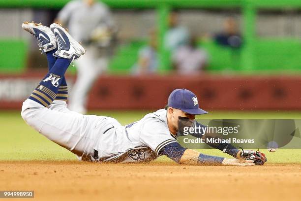 Hernan Perez of the Milwaukee Brewers drops a ground ball against the Miami Marlins in the fourth inning at Marlins Park on July 9, 2018 in Miami,...