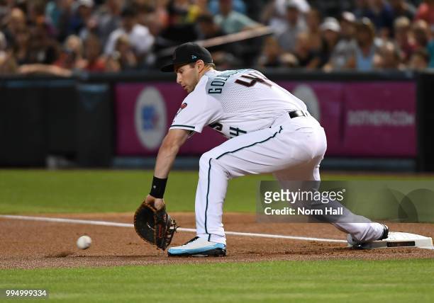 Paul Goldschmidt of the Arizona Diamondbacks makes a play on a one hop throw to first base against the San Diego Padres at Chase Field on July 6,...