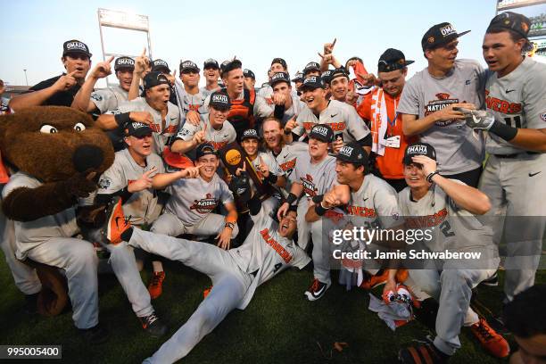 The Oregon State Beavers celebrate after defeating the Arkansas Razorbacks during the Division I Men's Baseball Championship held at TD Ameritrade...