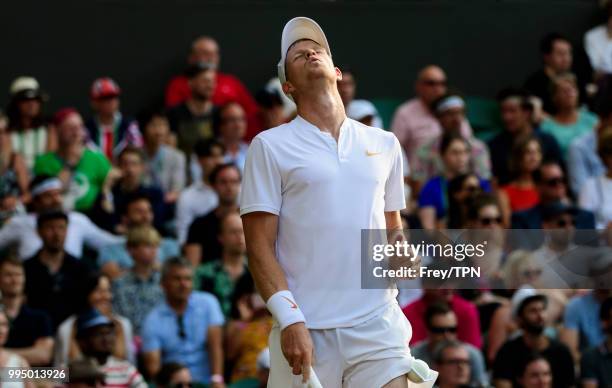 Kyle Edmund of Great Britain looks frustrated against Novak Djokovic of Serbia in the third round of the gentleman's singles at the All England Lawn...