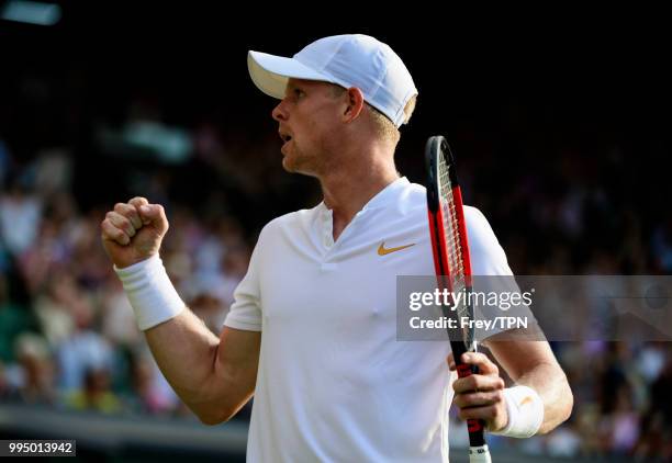 Kyle Edmund of Great Britain celebrates against Novak Djokovic of Serbia in the third round of the gentleman's singles at the All England Lawn Tennis...