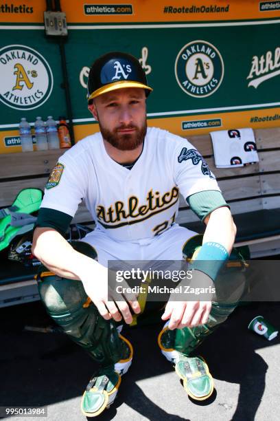 Jonathan Lucroy of the Oakland Athletics sits in the dugout prior to the game against the Houston Astros at the Oakland Alameda Coliseum on June 14,...