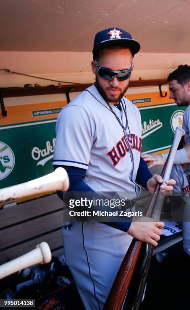 George Springer of the Houston Astros stands in the dugout prior to the game against the Oakland Athletics at the Oakland Alameda Coliseum on June...