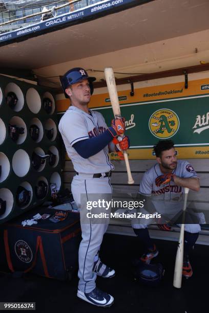 Alex Bregman of the Houston Astros stands in the dugout prior to the game against the Oakland Athletics at the Oakland Alameda Coliseum on June 14,...