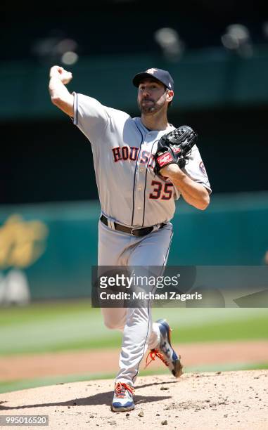 Justin Verlander of the Houston Astros pitches during the game against the Oakland Athletics at the Oakland Alameda Coliseum on June 14, 2018 in...