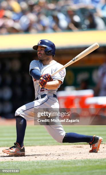 Jose Altuve of the Houston Astros bats during the game against the Oakland Athletics at the Oakland Alameda Coliseum on June 14, 2018 in Oakland,...