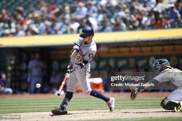 Josh Reddick of the Houston Astros bats during the game against the Oakland Athletics at the Oakland Alameda Coliseum on June 14, 2018 in Oakland,...