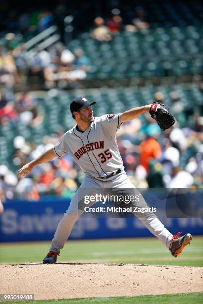 Justin Verlander of the Houston Astros pitches during the game against the Oakland Athletics at the Oakland Alameda Coliseum on June 14, 2018 in...