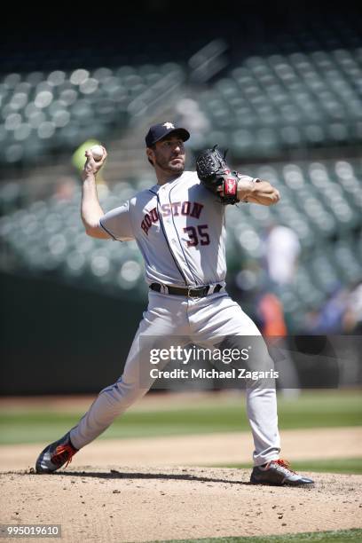 Justin Verlander of the Houston Astros pitches during the game against the Oakland Athletics at the Oakland Alameda Coliseum on June 14, 2018 in...