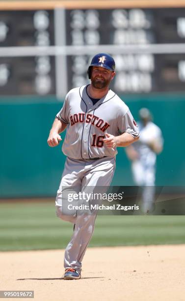 Brian McCann of the Houston Astros runs the bases after hitting a home run during the game against the Oakland Athletics at the Oakland Alameda...