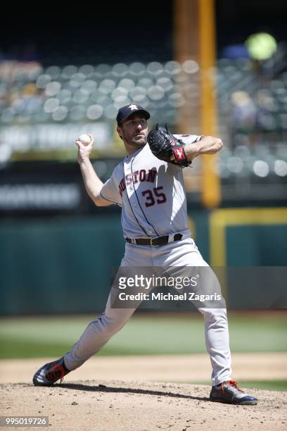 Justin Verlander of the Houston Astros pitches during the game against the Oakland Athletics at the Oakland Alameda Coliseum on June 14, 2018 in...